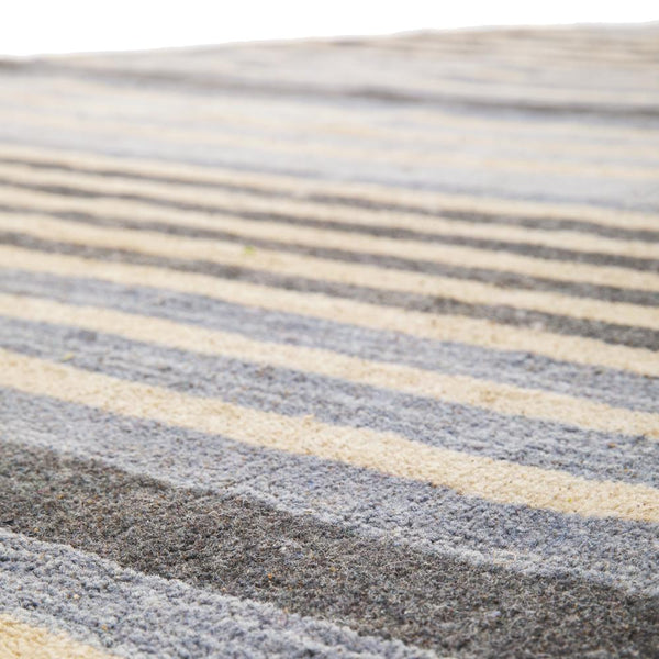 Round Grey and Blue Striped Rug Gil & Roy Props