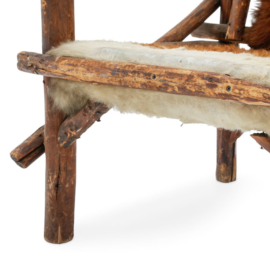 Raw Wood Armchair with Brown and White Animal Hide Fur