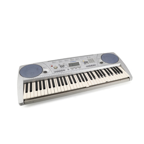 Silver Yamaha Keyboard w/ Blue Speakers