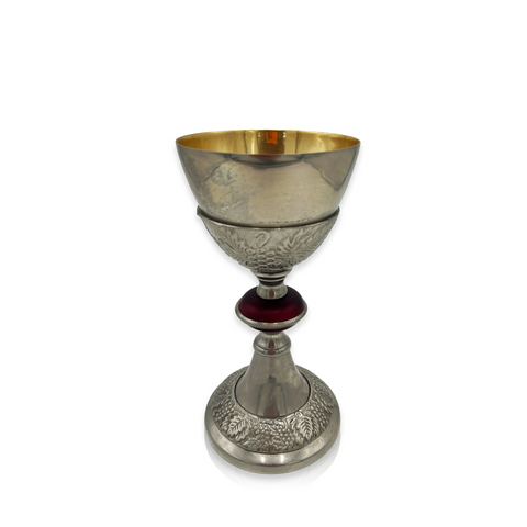 Ornate Silver and Gold Chalice with Embossed Grape Motif and Ruby Red Accent