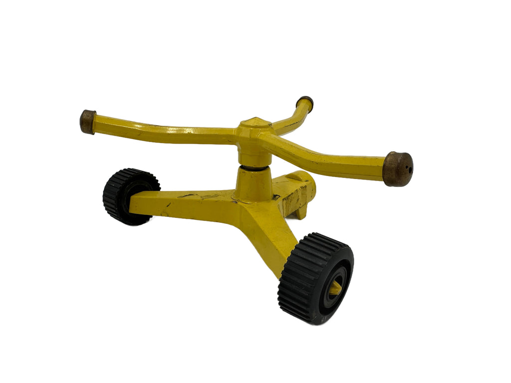 Distressed Yellow Metal Two-Wheel Rotating Garden Sprinkler