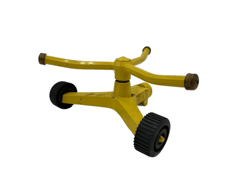 Distressed Yellow Metal Two-Wheel Rotating Garden Sprinkler