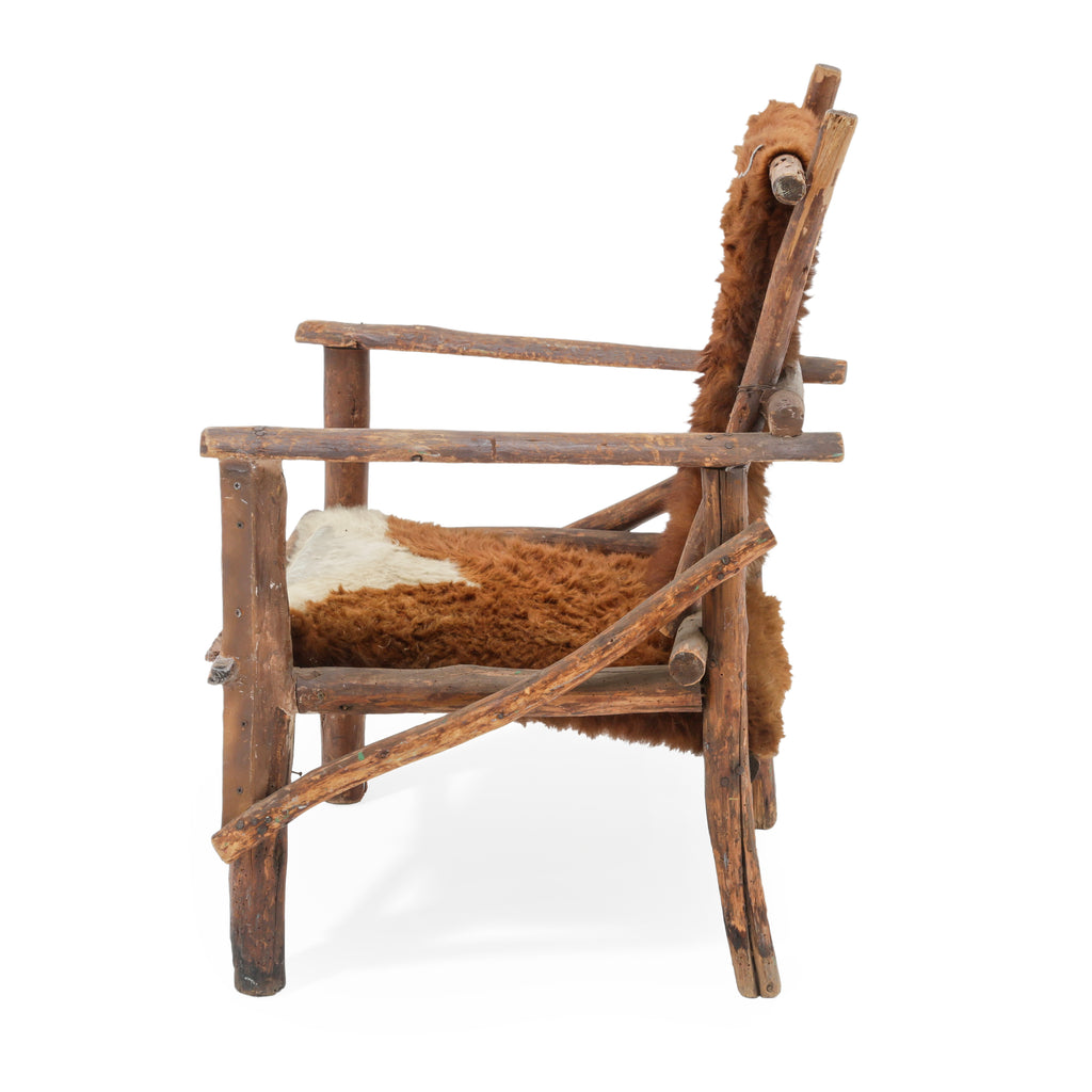 Raw Wood Armchair with Brown and White Animal Hide Fur