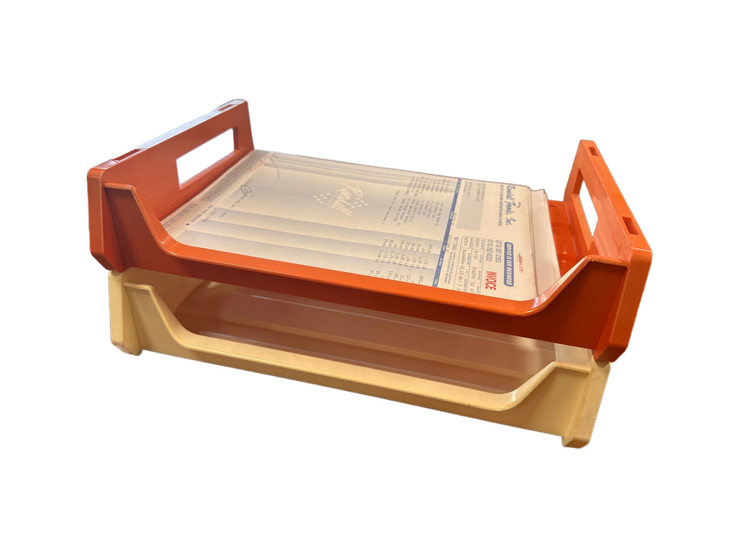 Stacked Burnt Orange and Cream Plastic Paper Trays