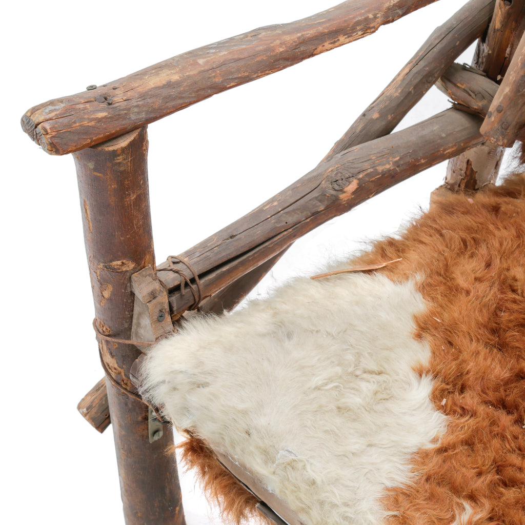 Rustic Branch Wood Chair with Brown and White Animal Hide Seat and Back