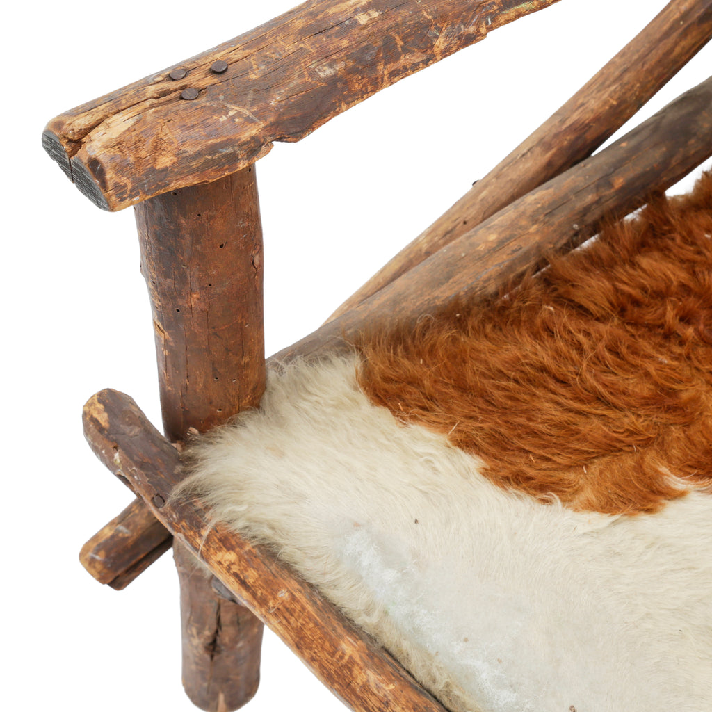 Raw Wood Armchair with Brown and White Animal Hide Fur