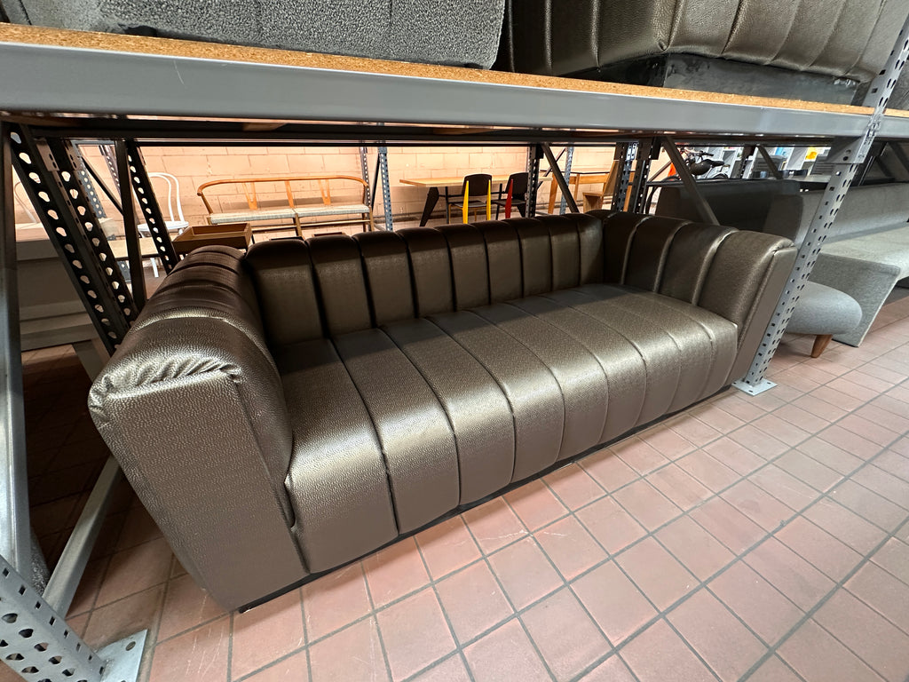 Sleek Metallic Bronze Channel Tufted Faux Leather Sofa