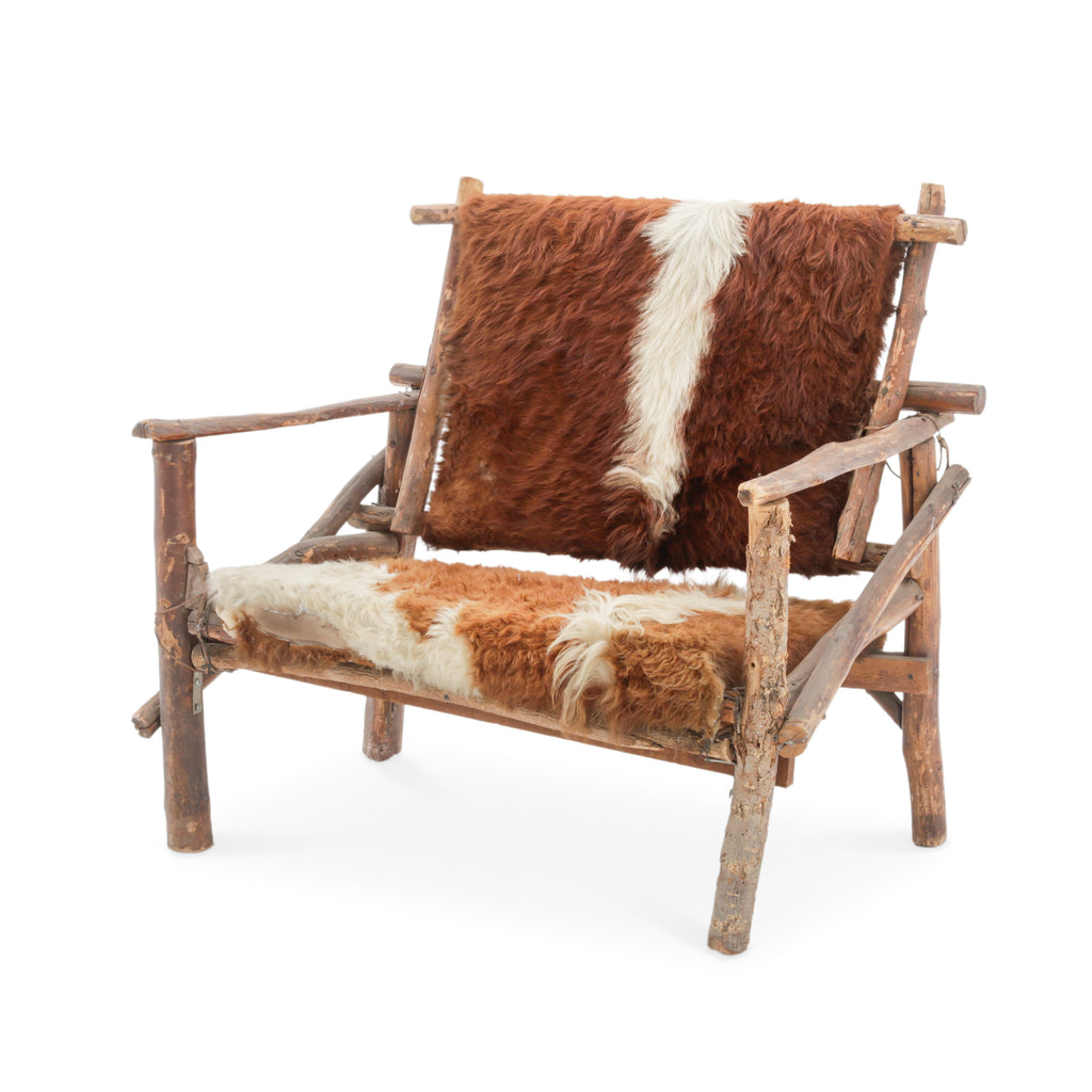 Rustic Branch Wood Chair with Brown and White Animal Hide Seat and Back