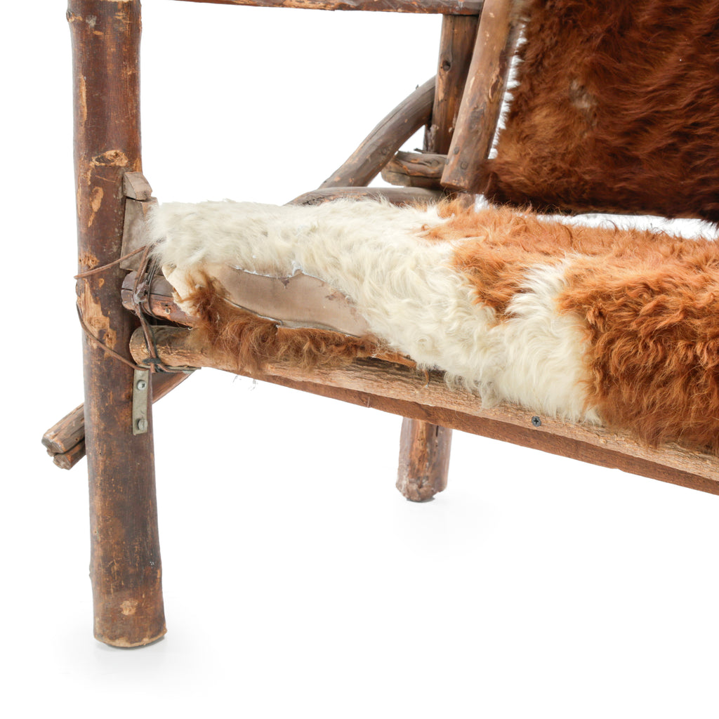 Rustic Branch Wood Chair with Brown and White Animal Hide Seat and Back