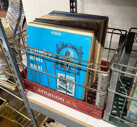 Assorted Vintage Vinyl Records in Galvanized Wire Rack
