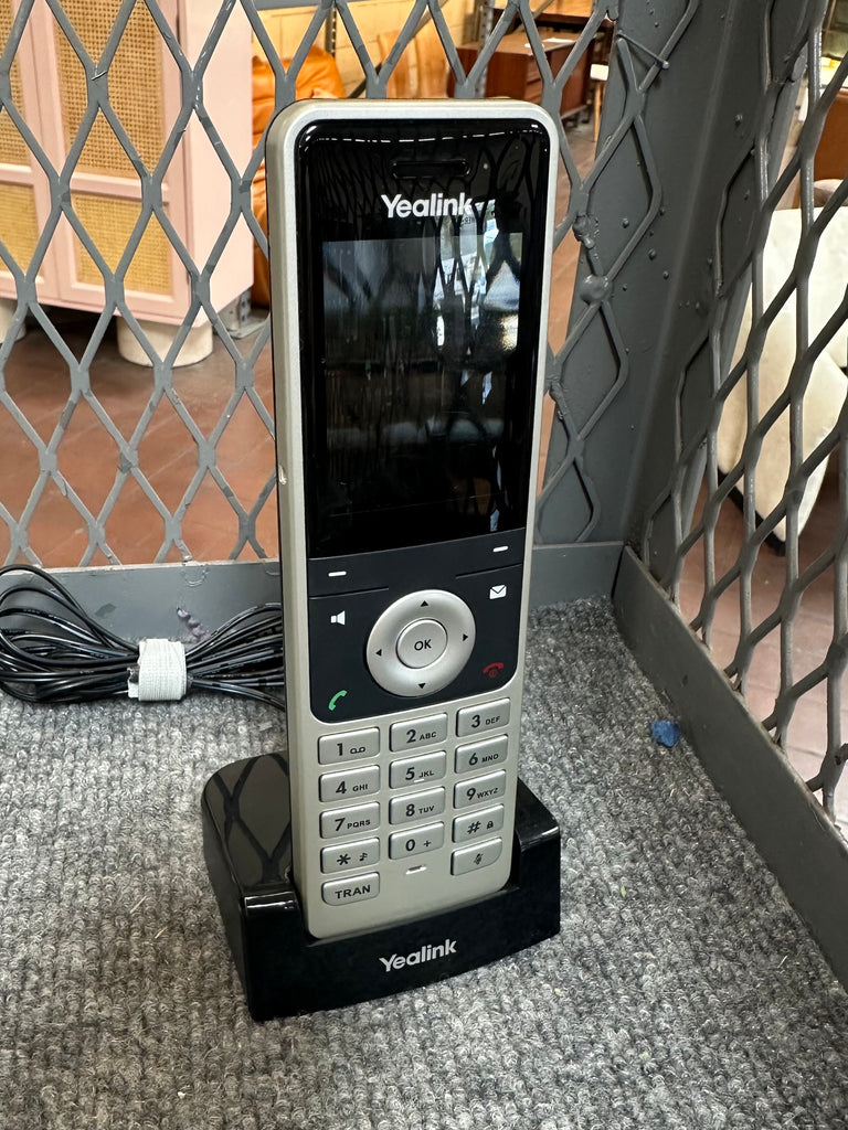 Silver and Black Yealink Cordless Phone with Charging Base