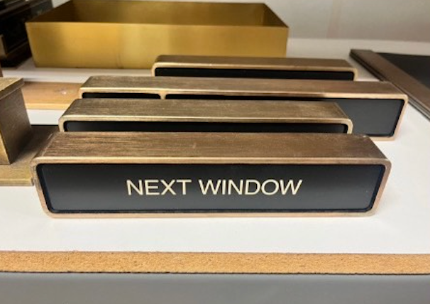 Black and Gold Next Window Sign