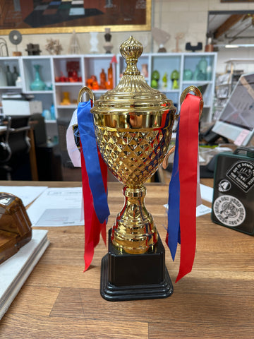 Shiny Gold Diamond-Textured Plastic Trophy with Red, White, and Blue Ribbons