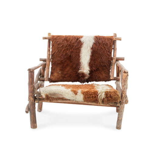 Rustic Branch Wood Chair with Brown and White Animal Hide Seat and Back