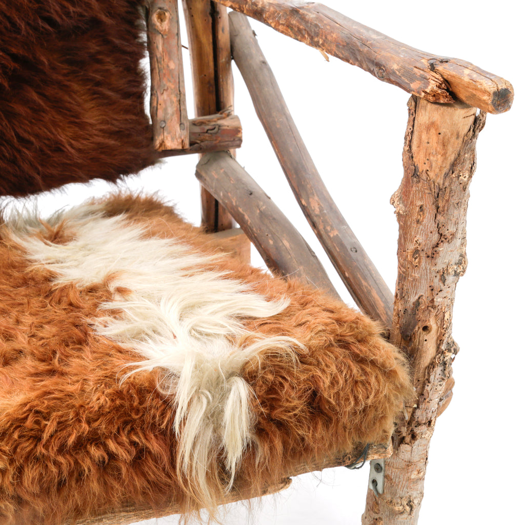 Rustic Branch Wood Chair with Brown and White Animal Hide Seat and Back