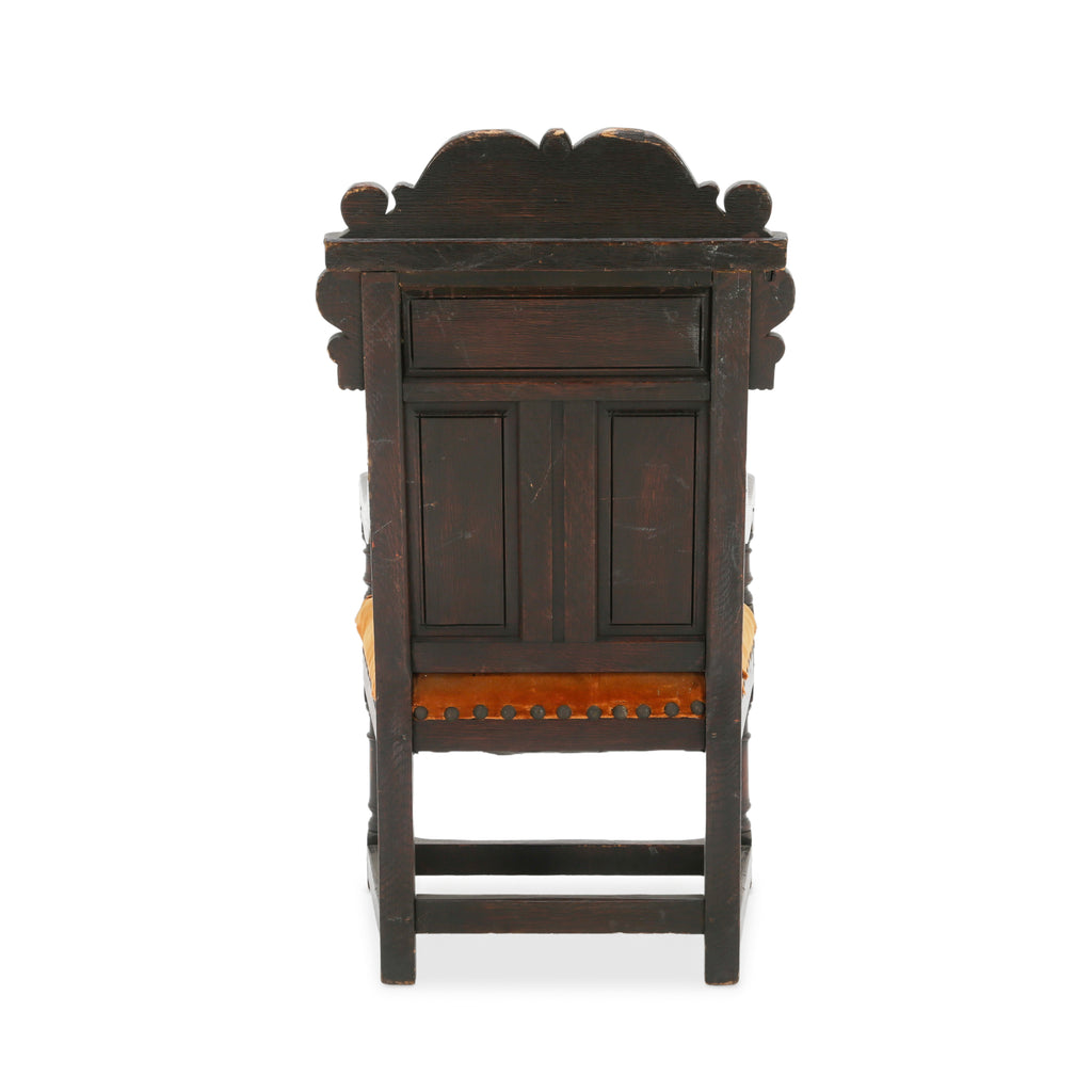 Distressed Dark Oak Carved Jacobean Armchair