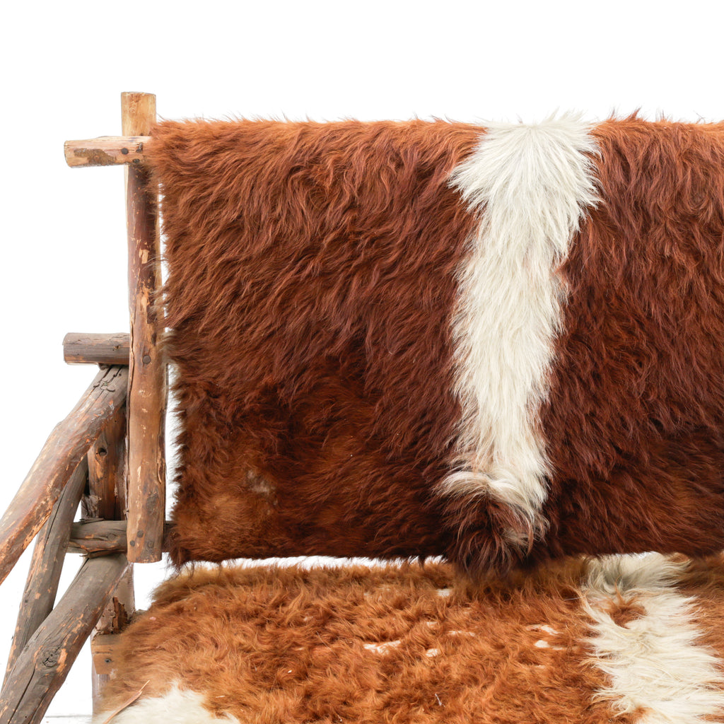 Rustic Branch Wood Chair with Brown and White Animal Hide Seat and Back