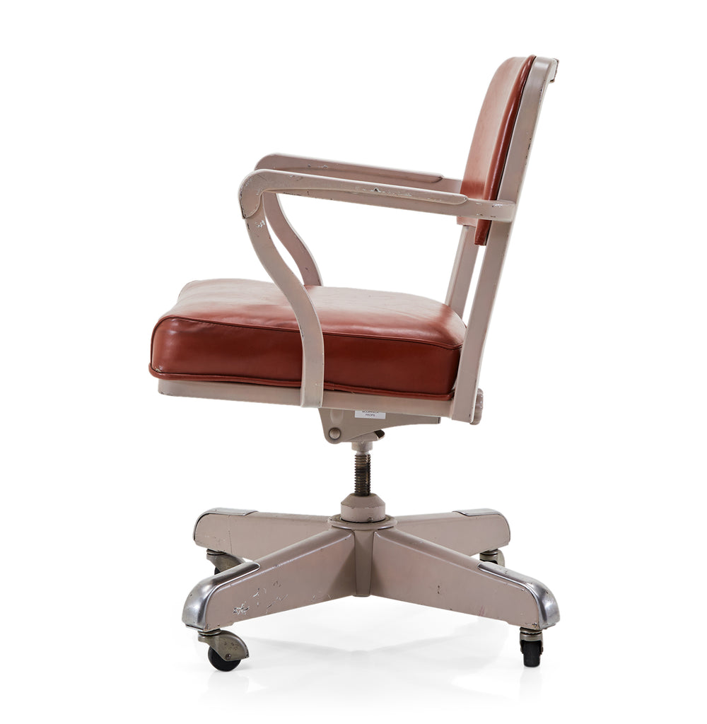 Red Vinyl and Beige Swivel Chair