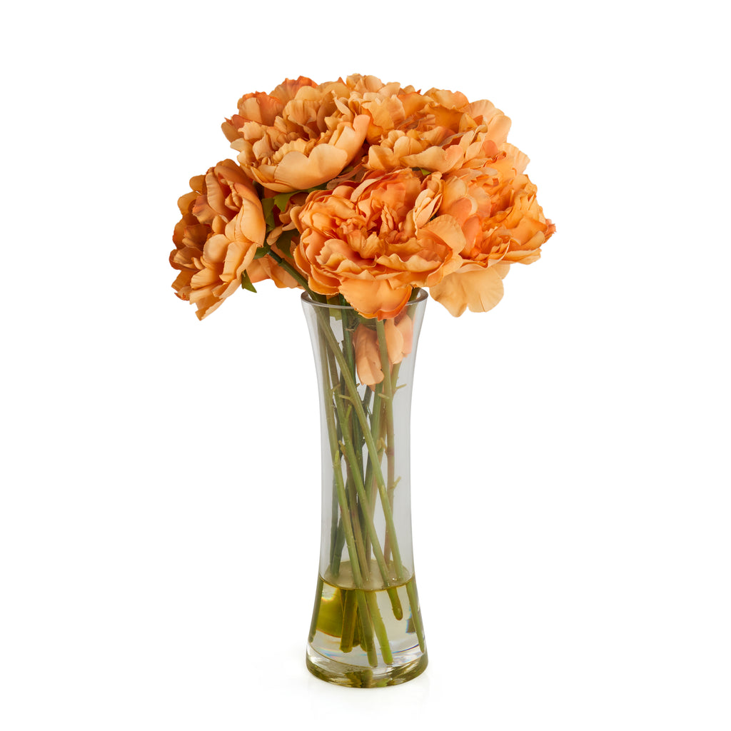 Faux orange flowers in vase