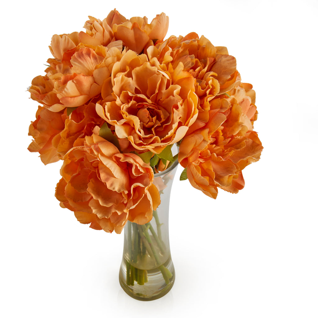 Faux orange flowers in vase
