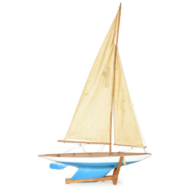 Blue and Cream Model Sailboat