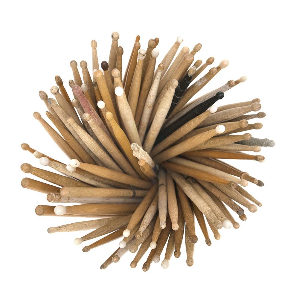 Brown Drumsticks In Glass Cylinder