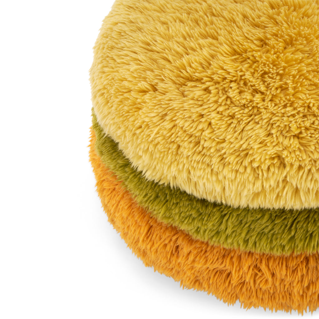 Multicolored Rolling Shag Ottoman with Stacking Pillows