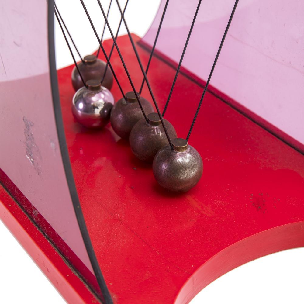 Red Lucite Newton's Cradle
