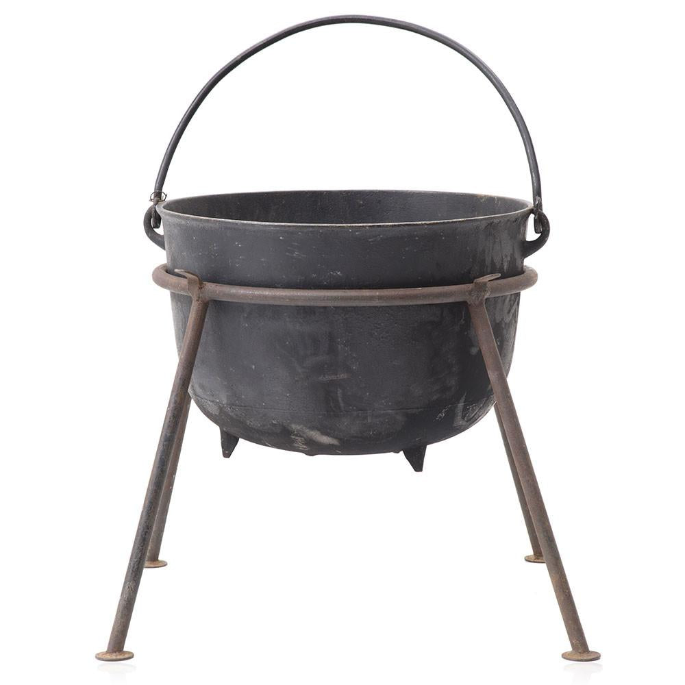 A Large Cast-iron Cauldron Suspended from a Crossbar, Ready To