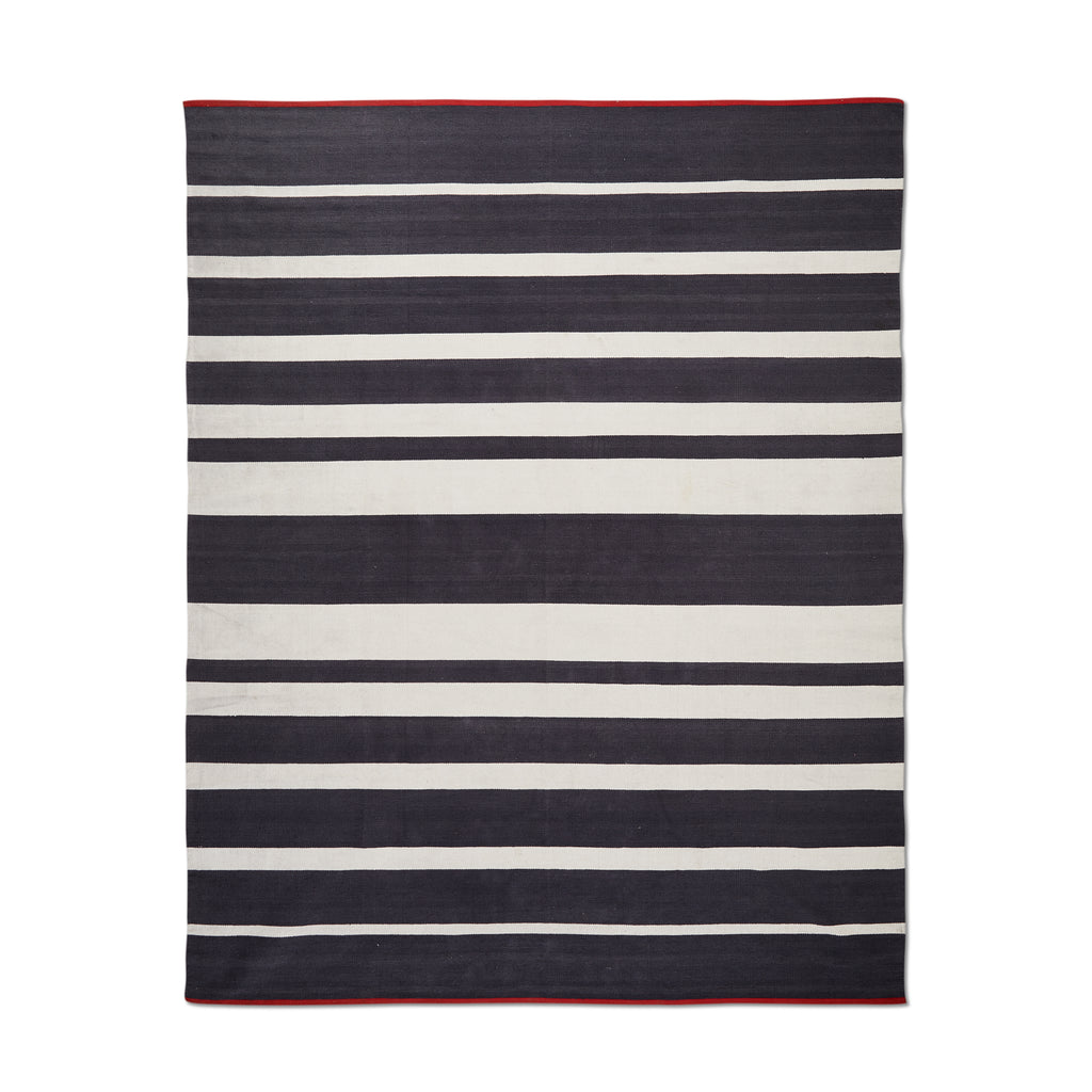 Black and White Striped Rug with Red Trim