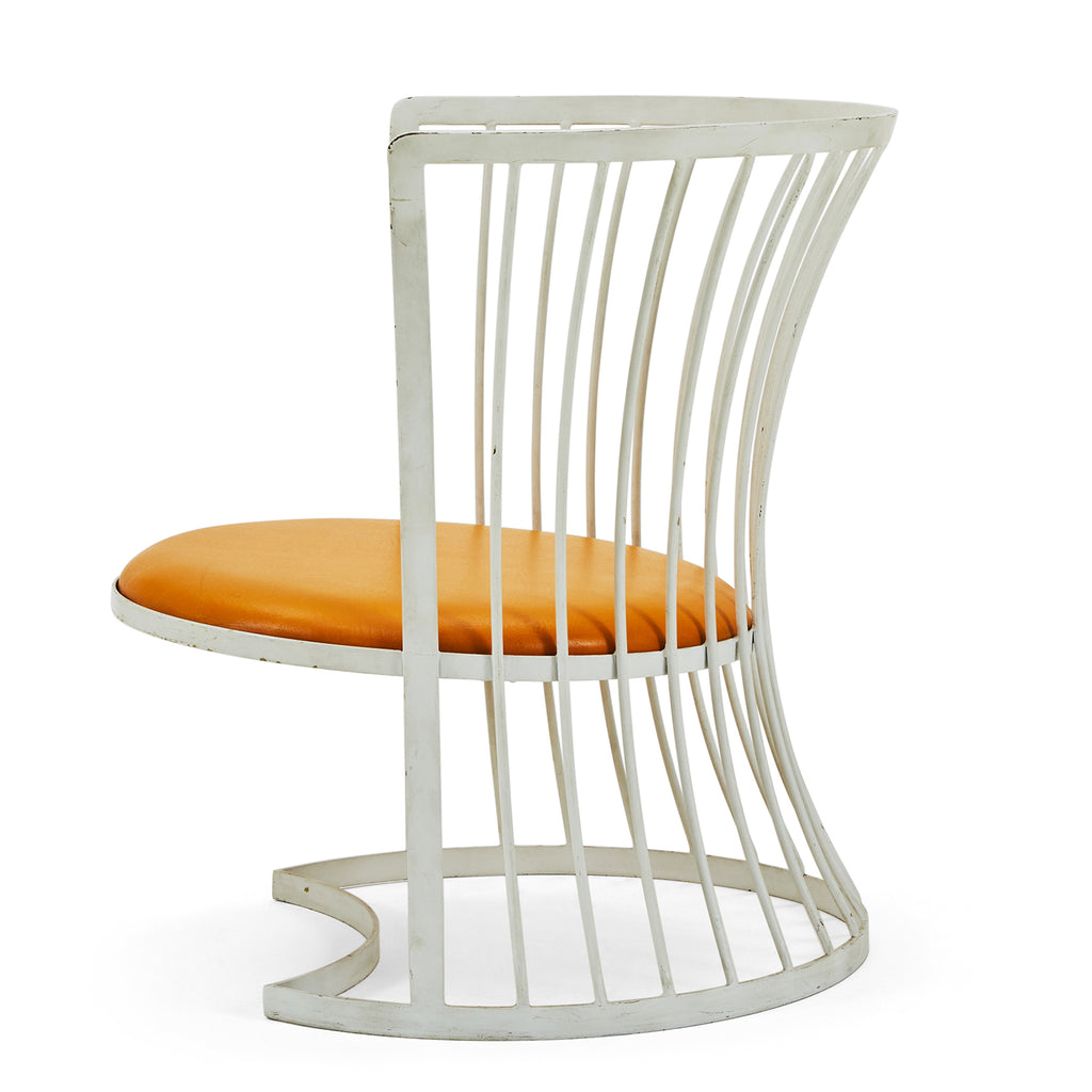 White Rod Chair with Orange Seat Cushion