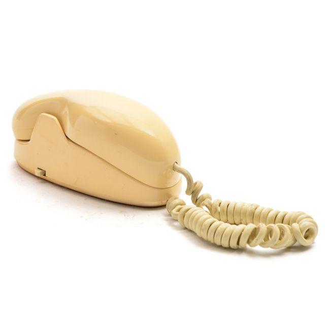 Beige Rotary Phone with Unique Shape